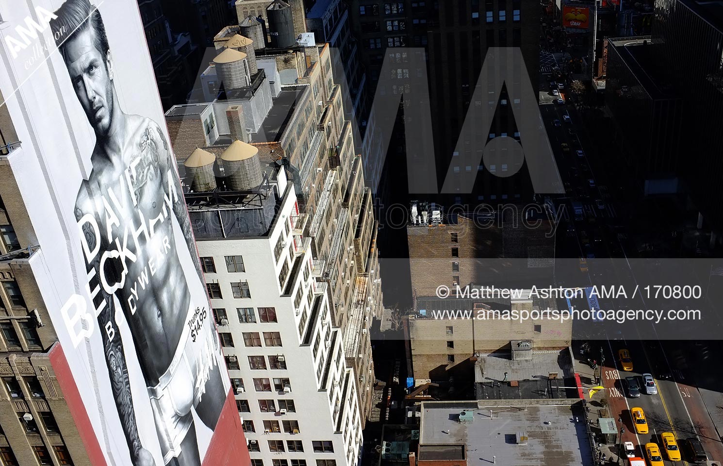 07 March 2012 - David Beckham advertising pictures in New York City - A giant image of David Beckham modelling the David Beckham Bodywear Collection on a high rise building on 8th Avenue / 34th Street  near Maddison Square Garden / Penn Station , NY, USA