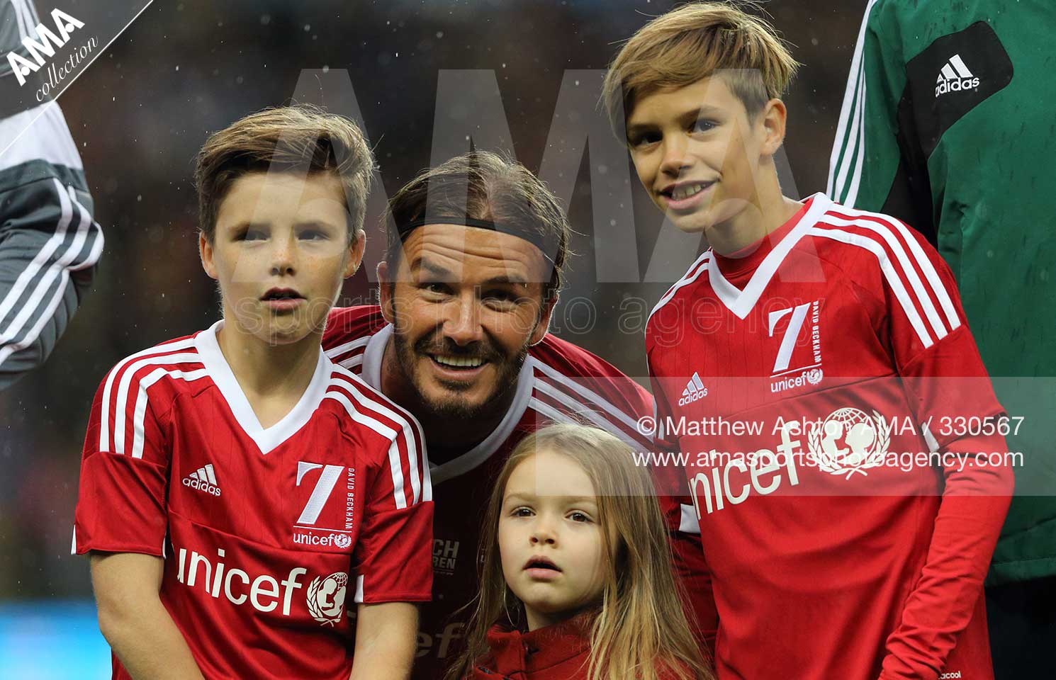 David Beckham of Great Britain and Ireland XI with his children Cruz, Harper and Romeo