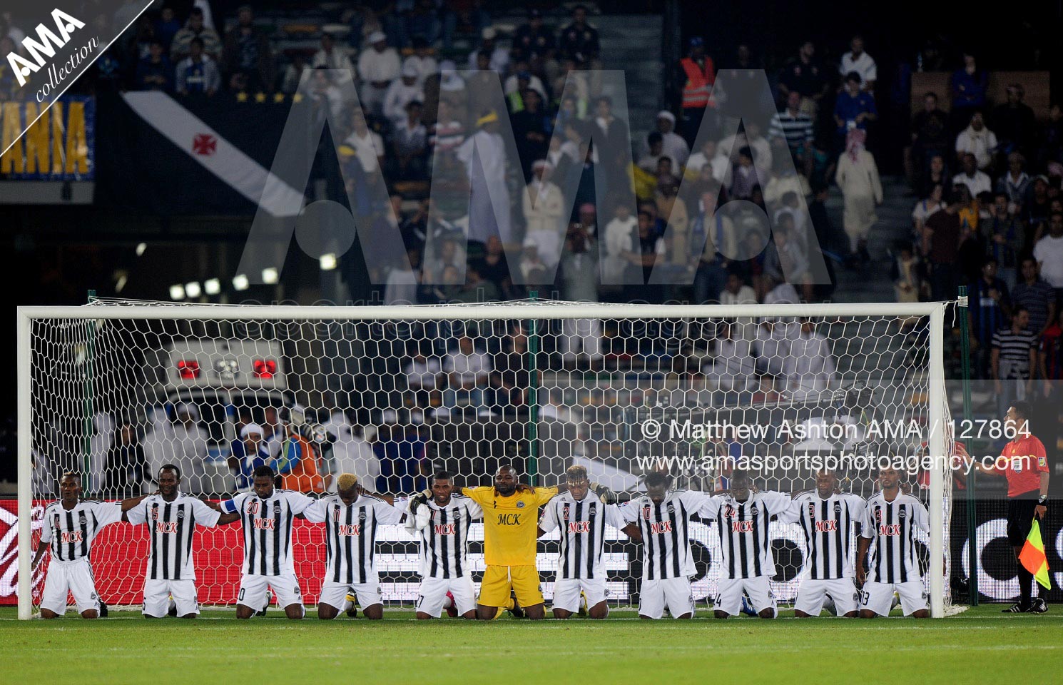 18 December 2010 - 2010 FIFA Club World Cup - Final  The TP Mazembe Englebert team prey in the goal mouth before the start of the game