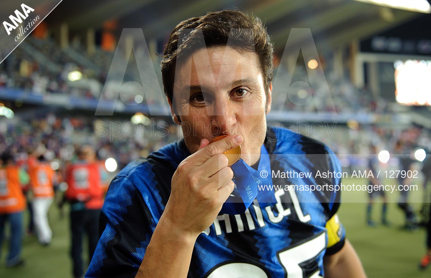 18 December 2010 - 2010 FIFA Club World Cup - Final - TP Mazembe Englebert v FC Internazionale - Javier Zanetti of FC Internazionale Milano kisses his FIFA Club World Cup winners medal