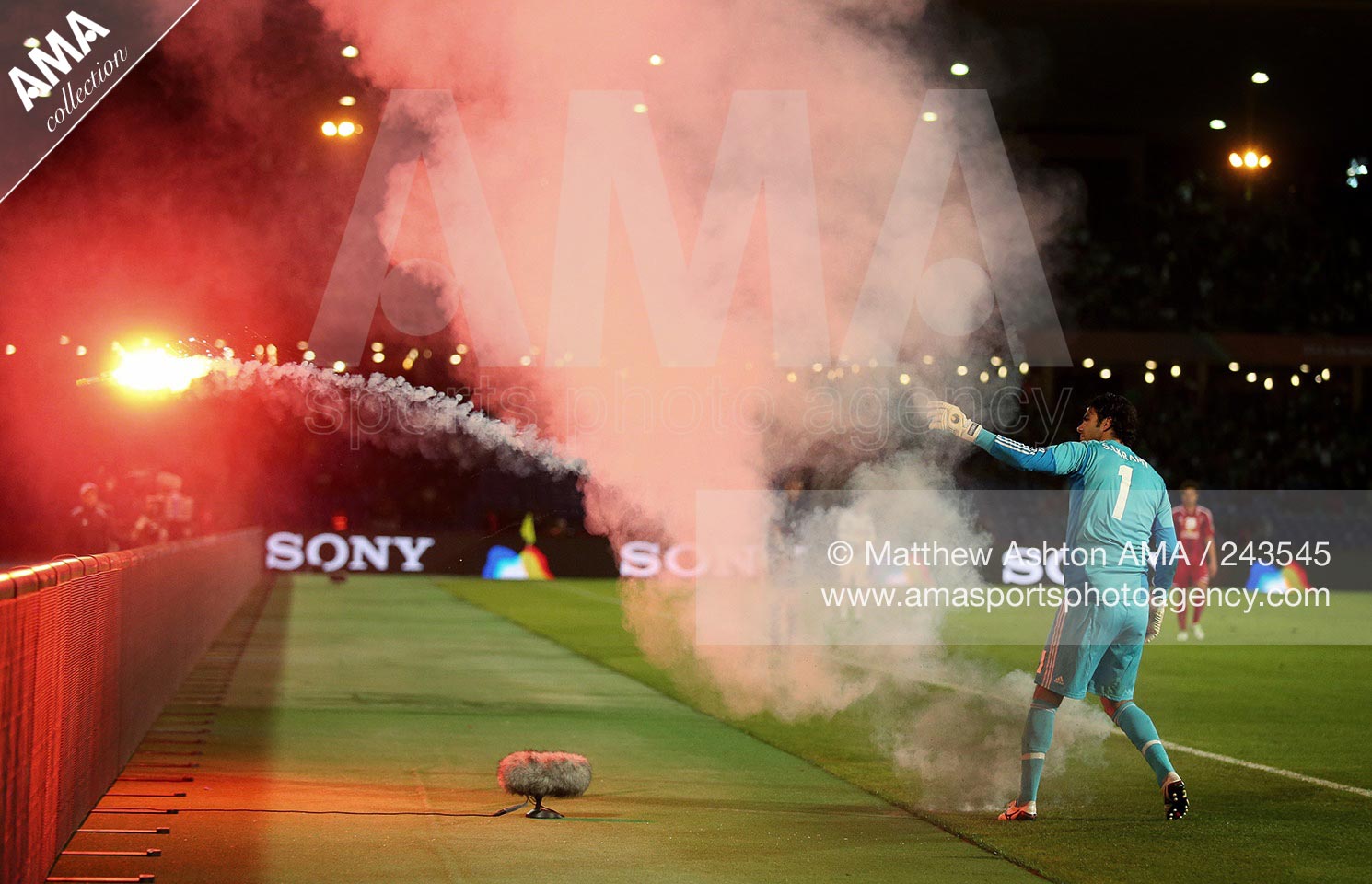 18 December 2013 - FIFA Club World Cup 2013 - 3/4 Place Play Off - Al-Ahly v Monterrey - Goalkeeper Sherif Ekramy of Al-Ahly throws a flare off the pitch