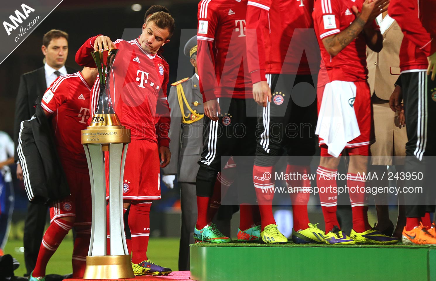 21 December 2013 - FIFA Club World Cup 2013 - FINAL - Bayern Munich v Raja Casablanca - Xherdan Shaqiri of Bayern Munich looks at the FIFA Club World Cup Trophy before getting his winners medal