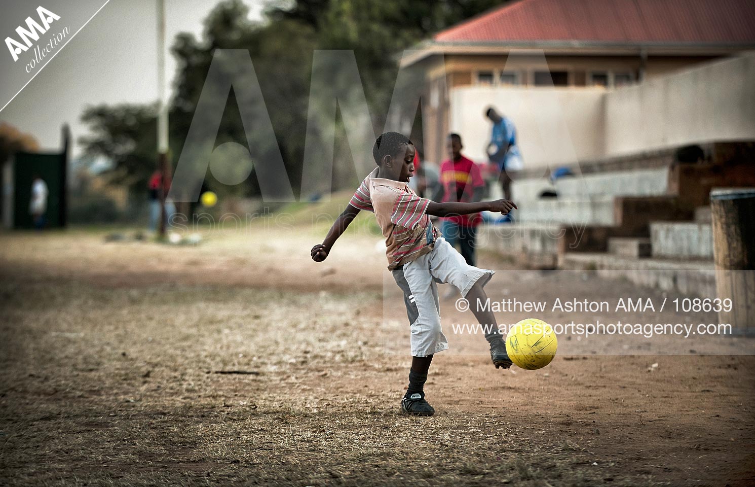 10 06 2006 South Africa Football - Young boys play football in the streets of Hondeydew and Cosmo City in Johannesburg.