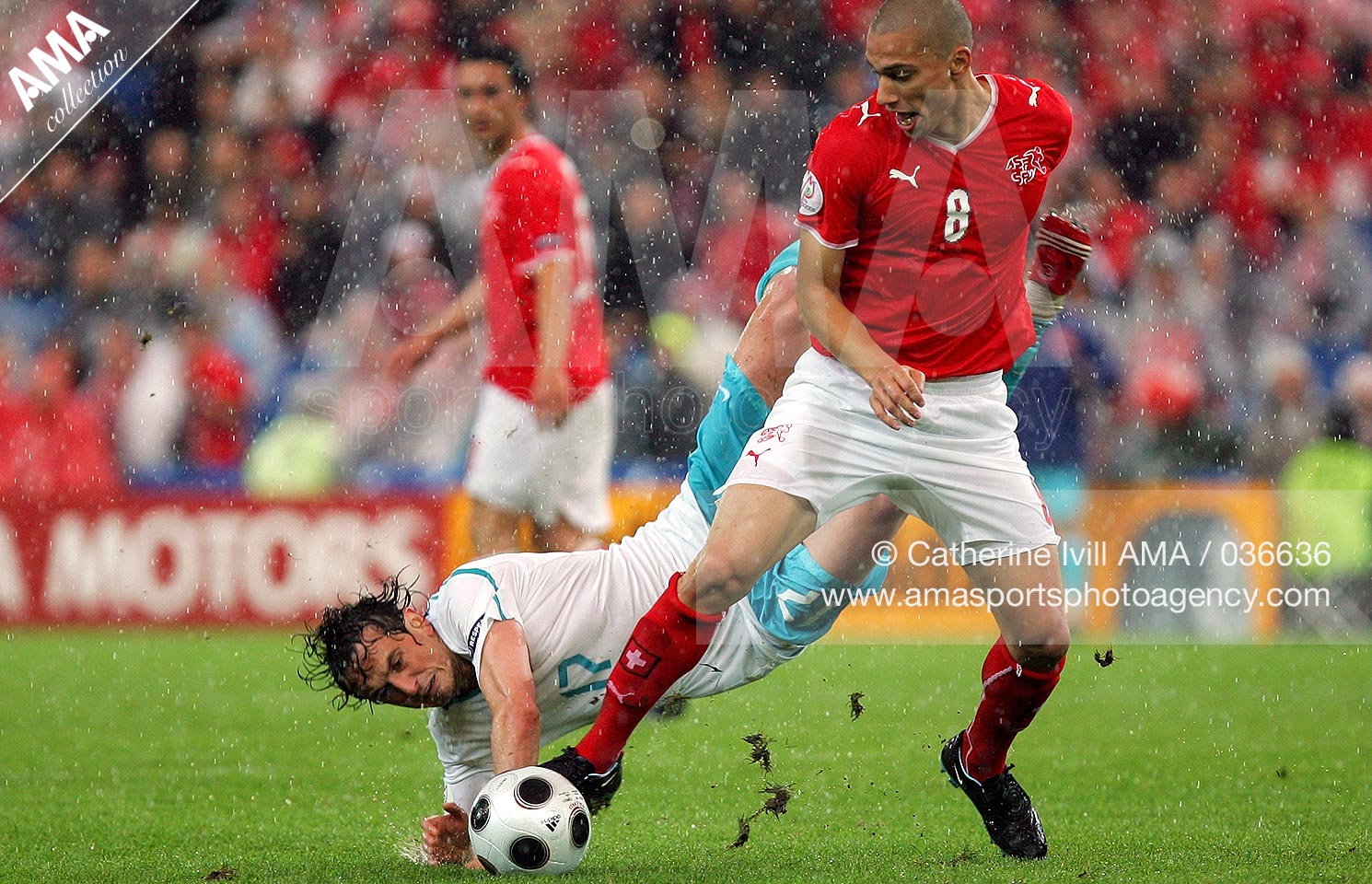 11 June 2008 - Euro 2008 - Group A - Switzerland v Turkey - Tuncay Sanli of Turkey goes over the top of Gokhan Inler of Switzerland
