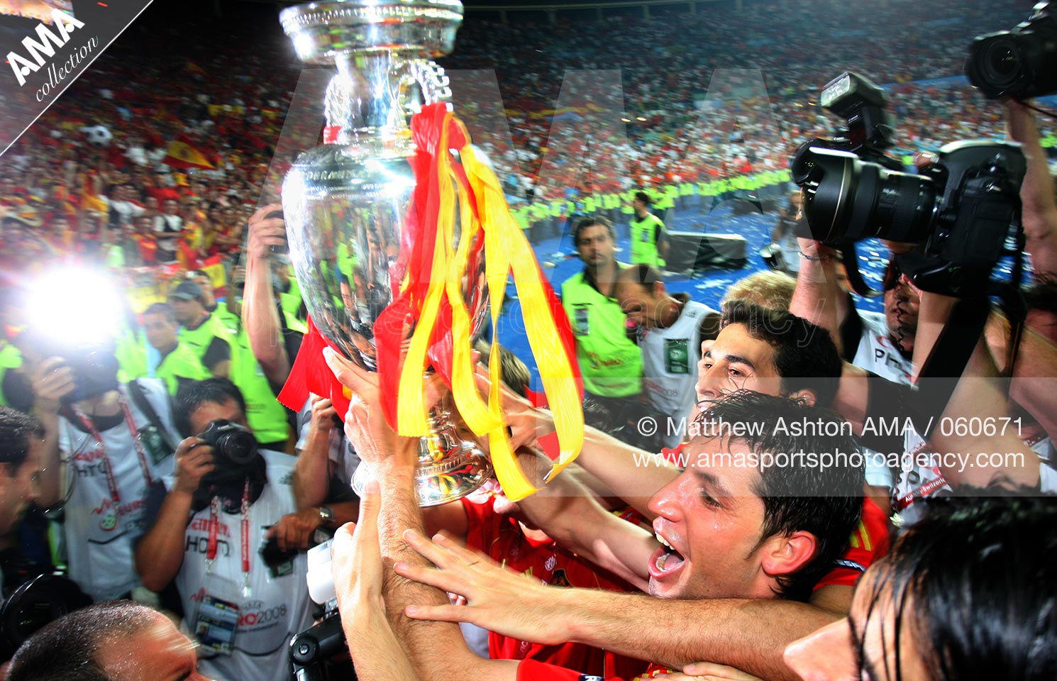 29 June 2008 - Euro 2008 - Final - Germany v Spain - Photographers chase the players of Spain as they celebrate with the European Championship Trophy after defeating Germany 1-0