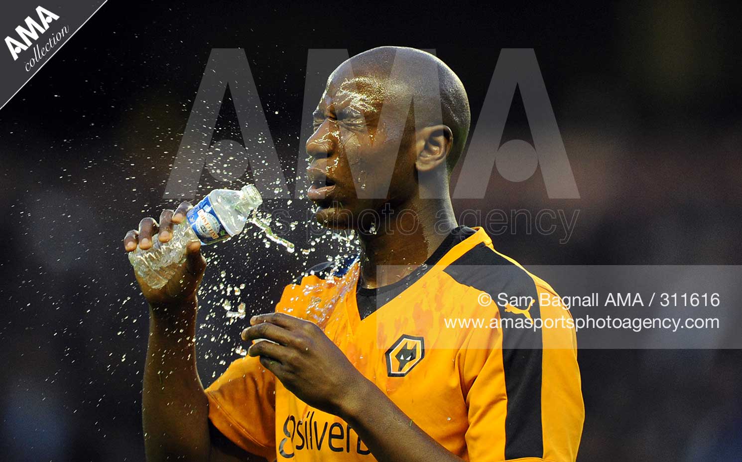 Benik Afobe of Wolverhampton Wanderers pours water over his face