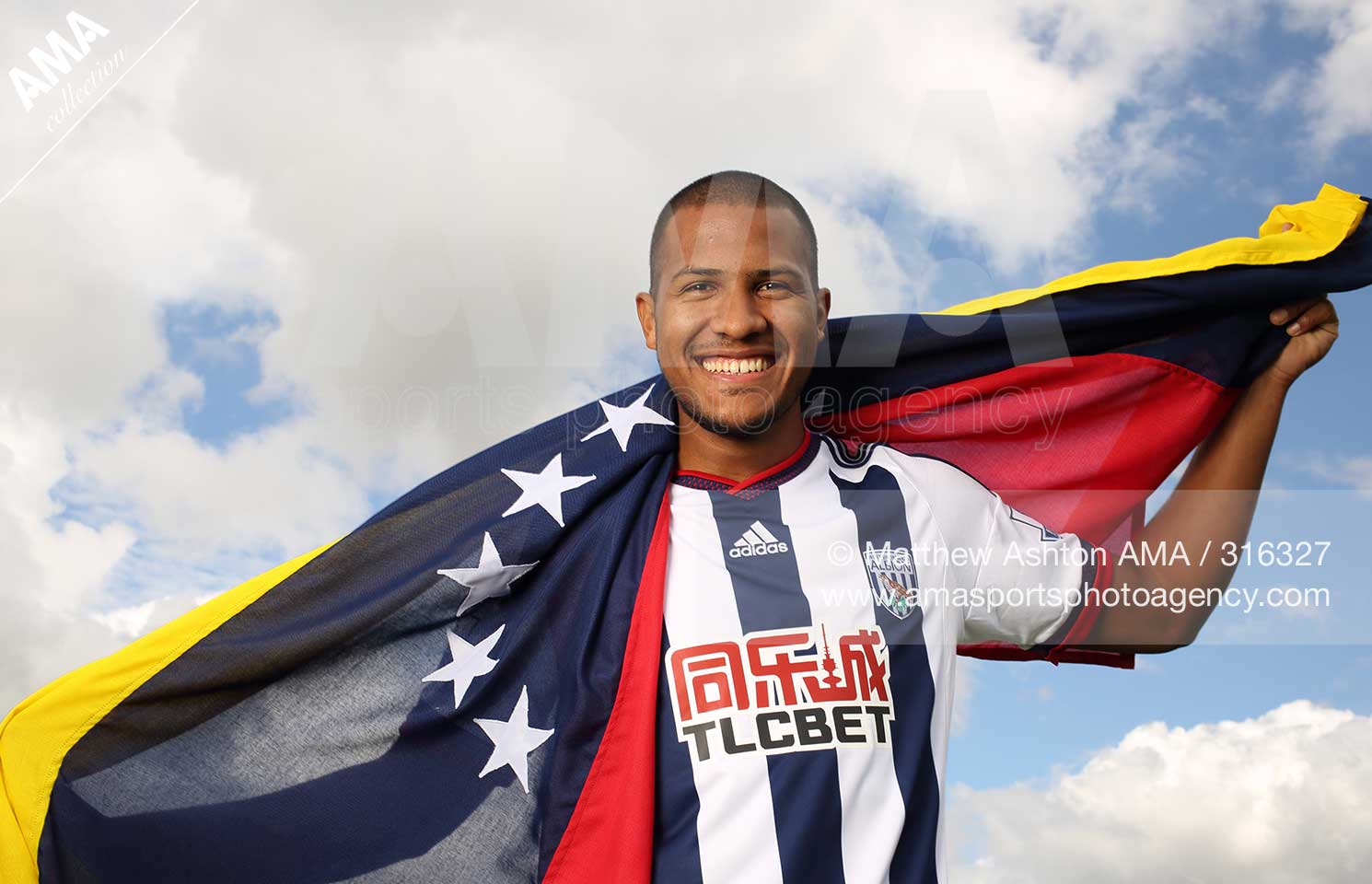 03 August 2015  West Bromwich Albion sign Jose Salomon Rondon holding the flag of Venuzuala  © Matthew Ashton / AMA 316327