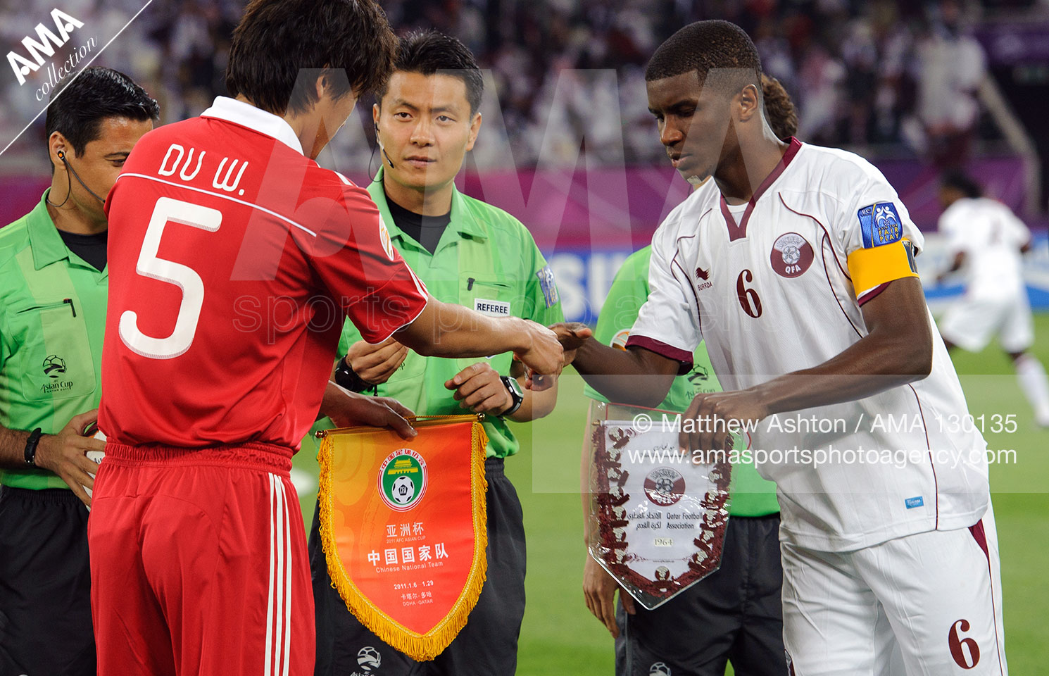 12th January 2011 - Asian Cup 2011 - Group A - China v Qatar - Du Wei of China and Bilal Mohammed of Qatar exchange pennants before the game