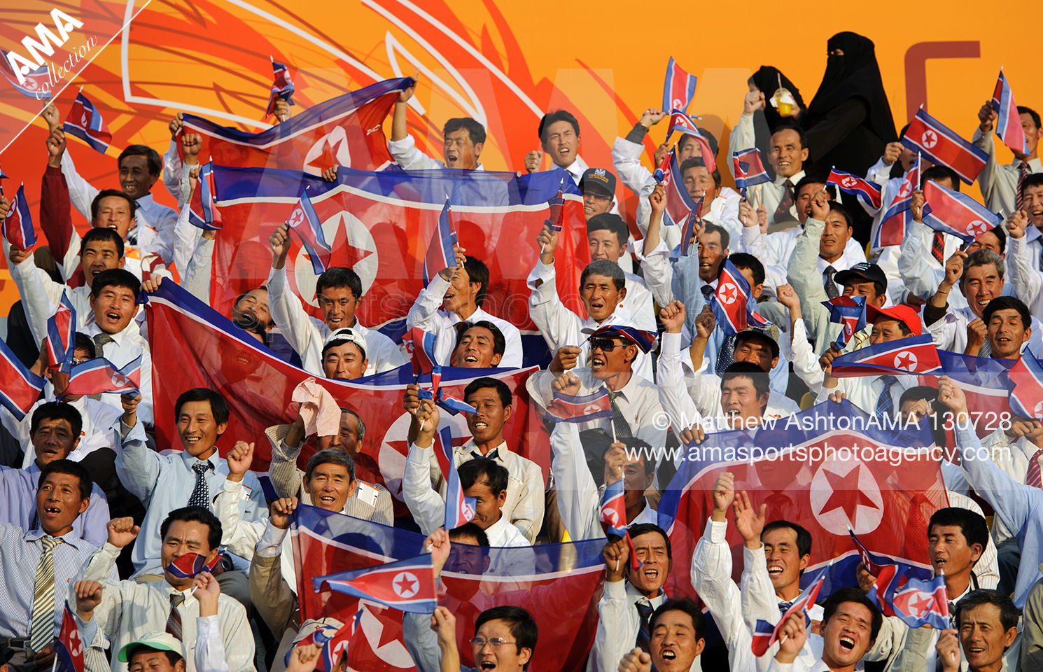 15th January 2011 - Asian Cup 2011 - Group D - Iran v North Korea - Fans of North Korea sit watching the Asian Cup 2011, Group D match Iran v North Korea wearing shirt and ties