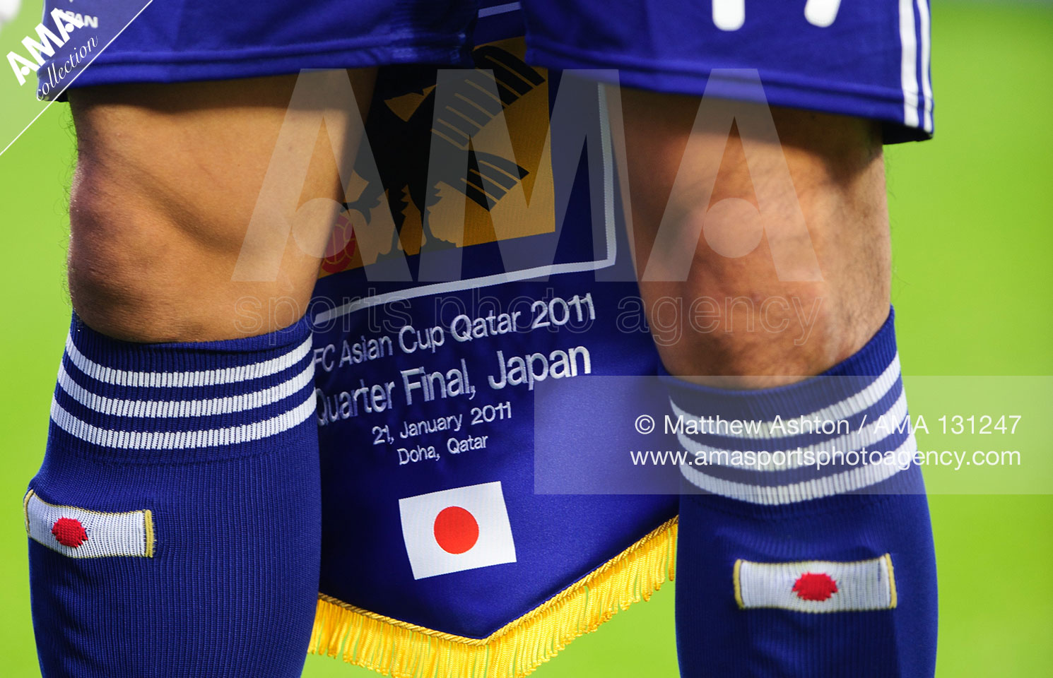 21st January 2011 - Asian Cup 2011 - Quarter Final - Japan v Qatar - Captain Makoto Hasebe of Japan holds the pennant during the national anthems that was later presented to opponents Qatar