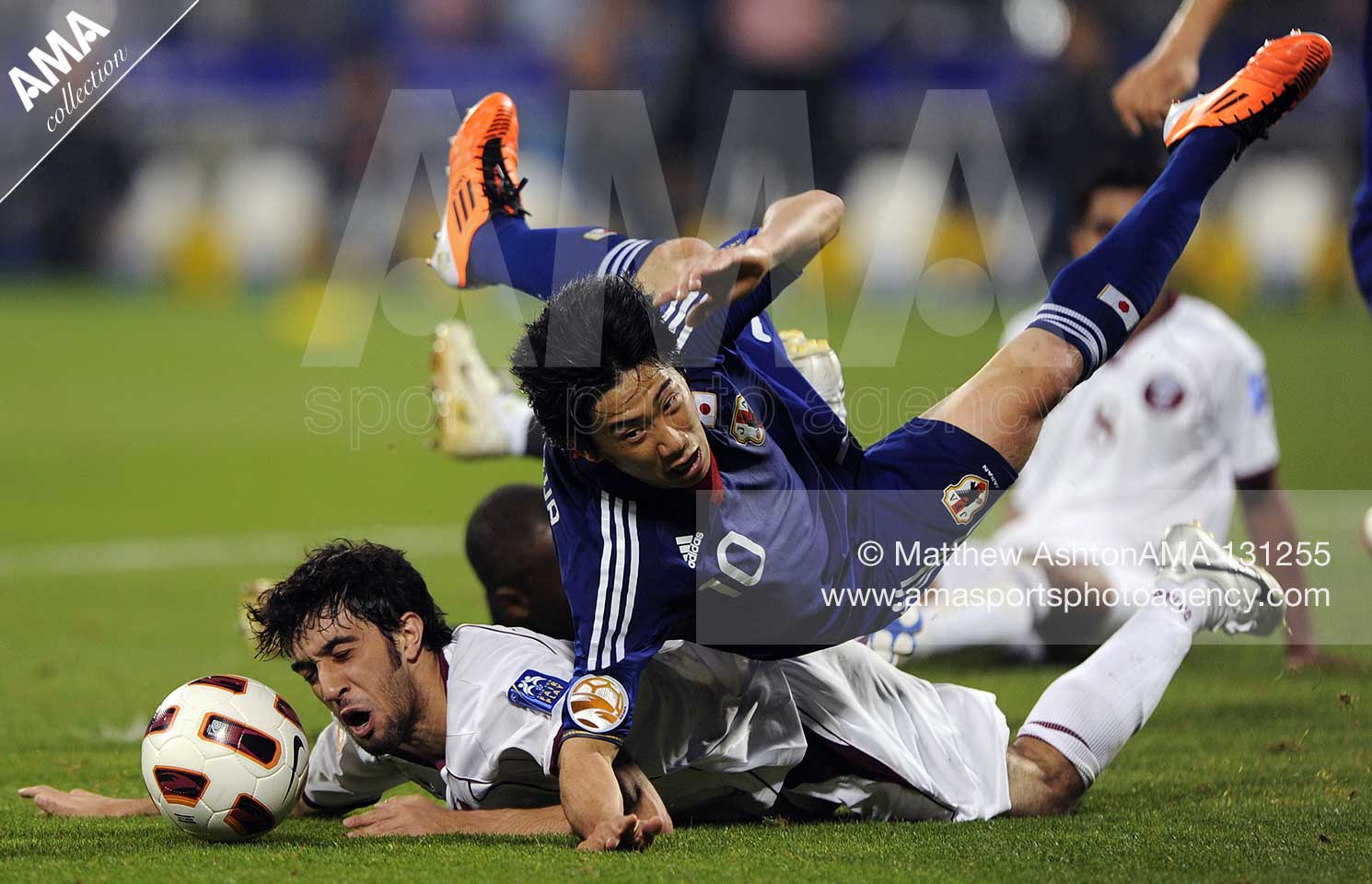 21st January 2011 - Asian Cup 2011 - Quarter Final - Japan v Qatar - Khaled Muftah of Qatar fouls Shinji Kagawa of Japan