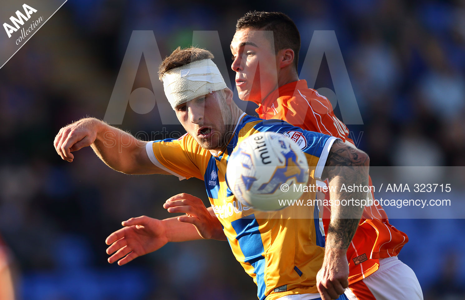 James Collins of Shrewsbury Town and Lloyd Jones of Blackpool