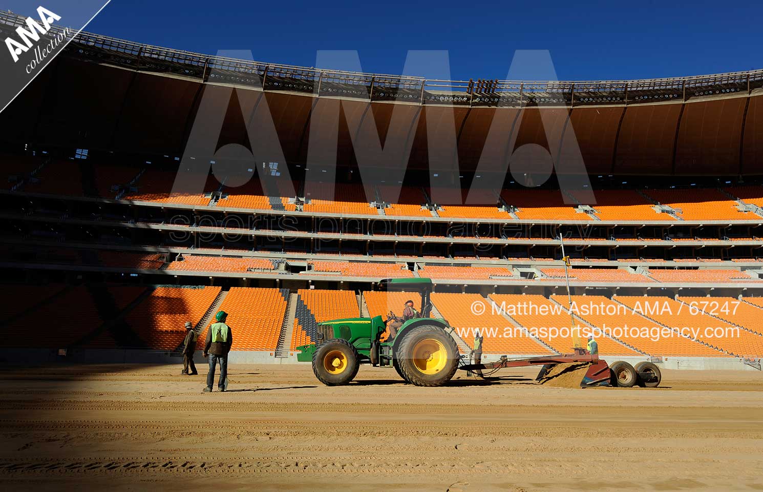 The pitch is leveled out using lazer technology during the construction of Soccer City Stadium, Johannesburg - venue for FIFA 2010 South Africa World Cup Final.