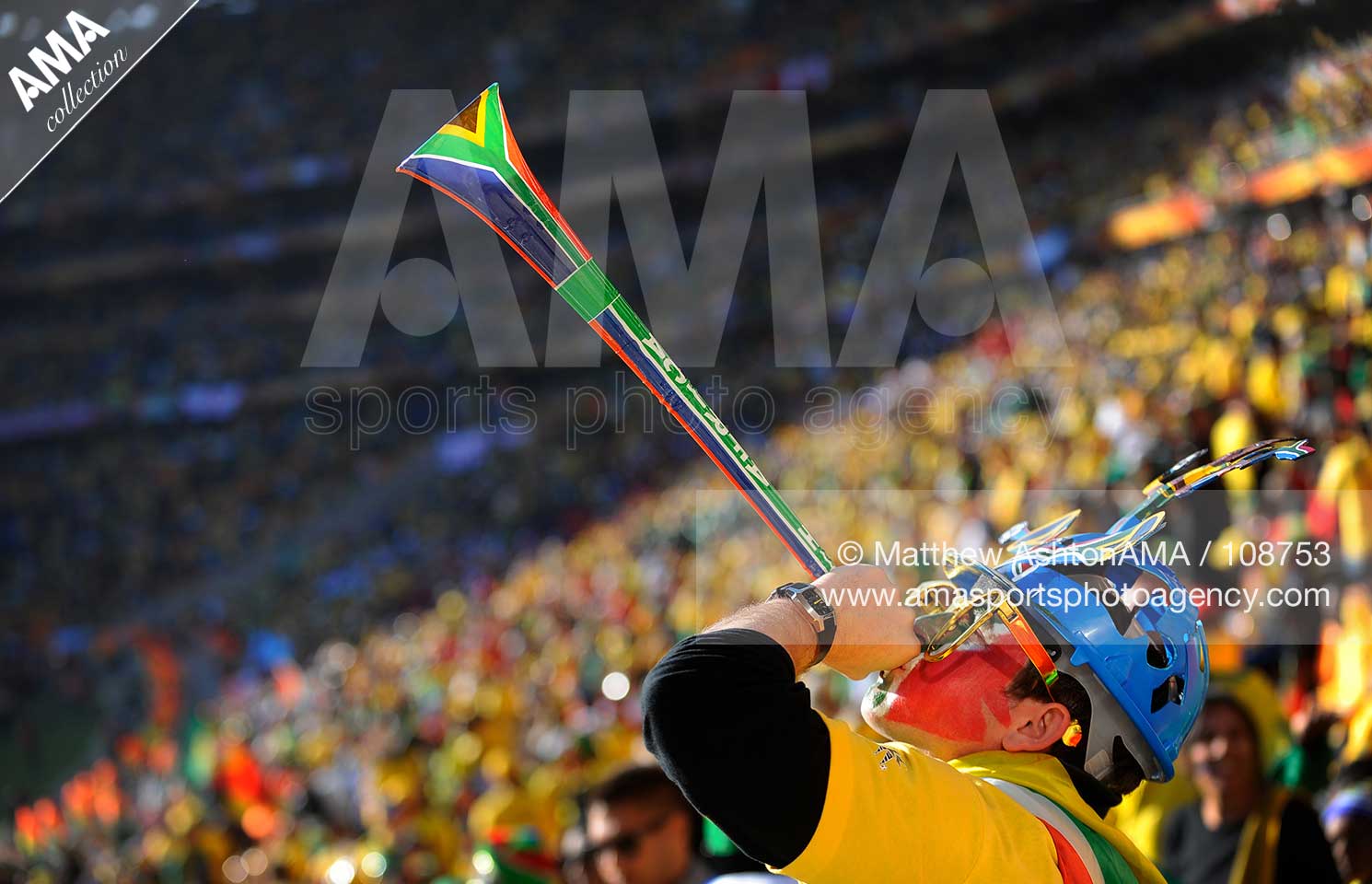 Soccer - 2010 FIFA World Cup South Africa - Group A - South Africa v Mexico A fan of South Africa blows his Vuvuzela horn
