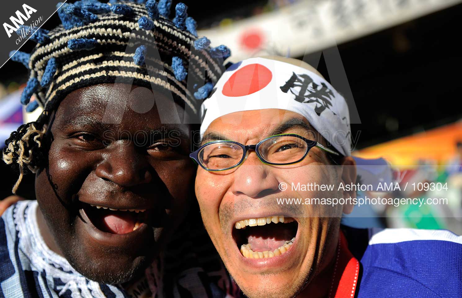 2010 FIFA World Cup South Africa - Group E - Japan v Cameroon A fan of Cameroon and a fan of Japan enjoy the game