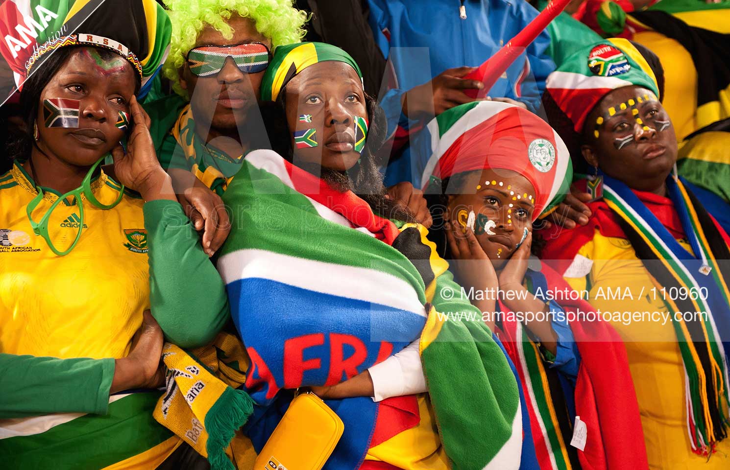 Dejected fans of South Africa as the home nation is eliminated out of 2010 FIFA World Cup South Africa