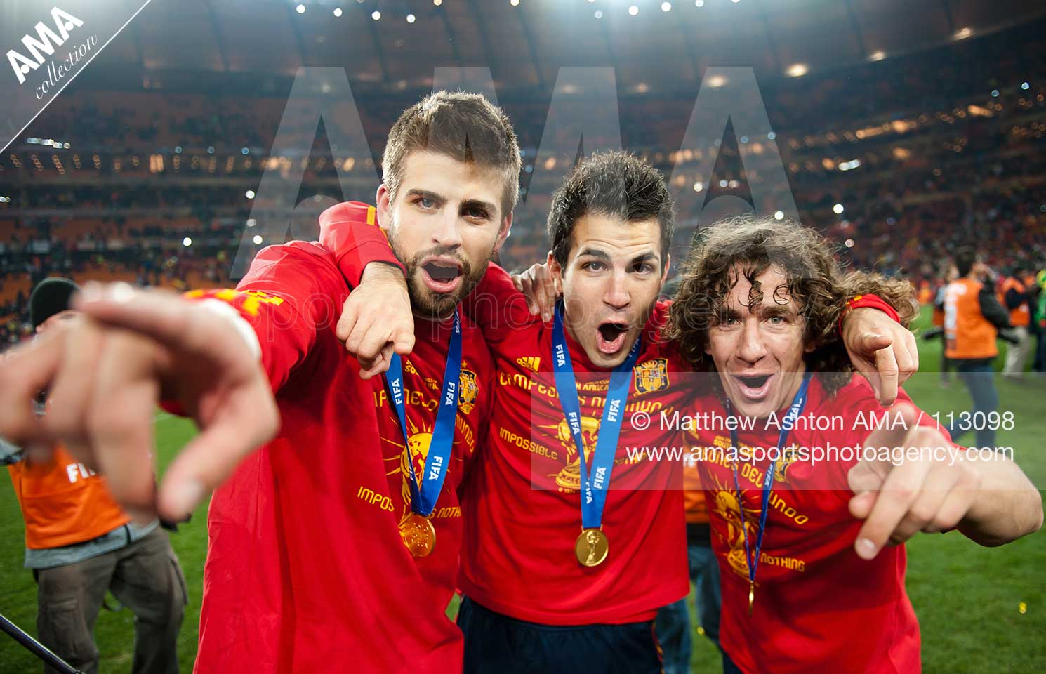 Gerard Pique, Cesc Fabregas and Carles Puyol of Spain celebrate after a 0-1 victory over the Netherlands and winning the 2010 FIFA World Cup South Africa Final