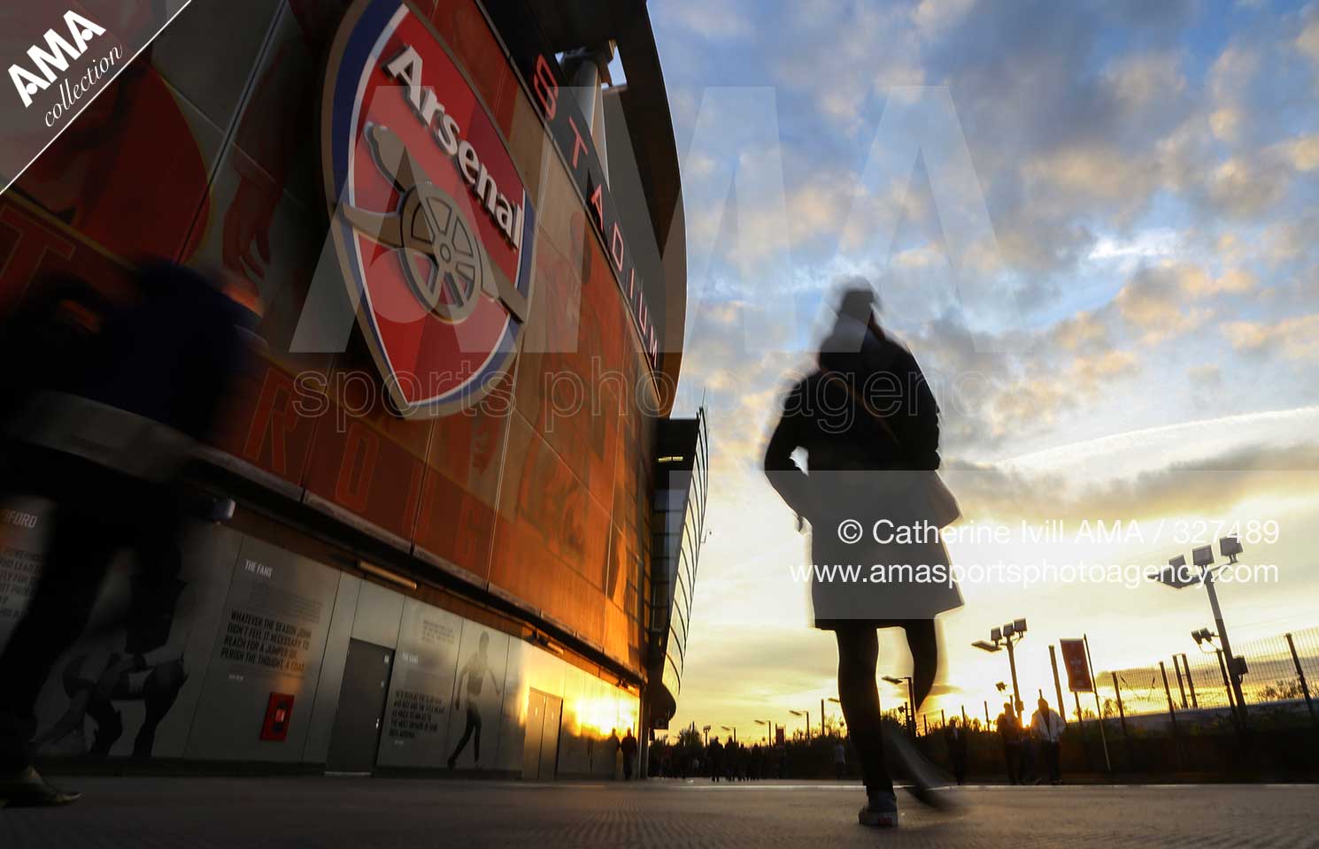 UEFA Champions League Group F - Arsenal v Bayern Munich - Fans walk past the badge on the Emirates stadium, home of Arsenal