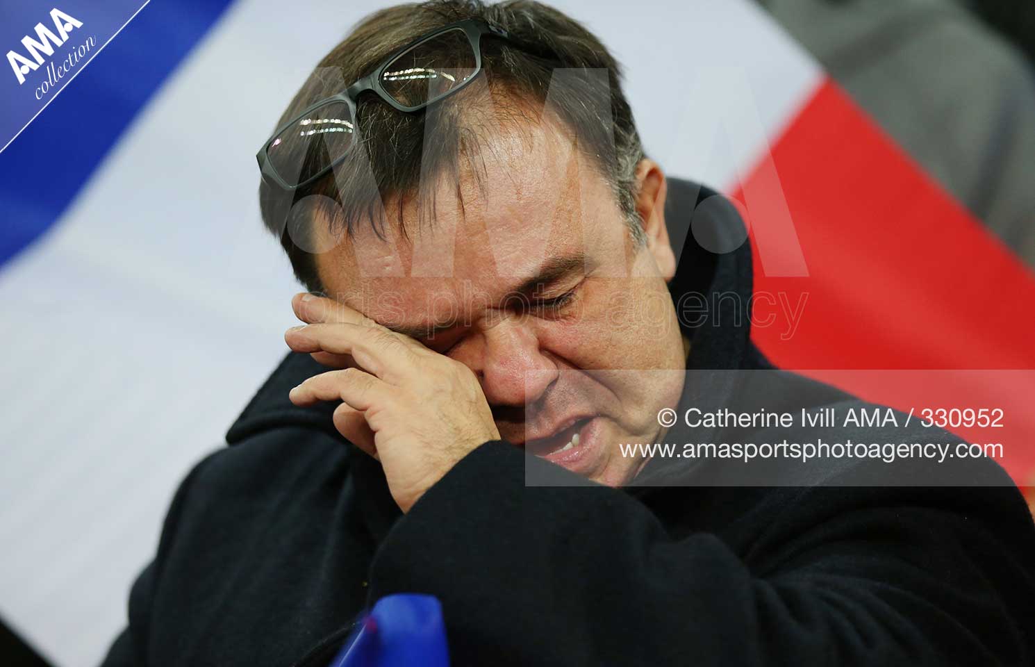 International Friendly - England v France - A France fan wipes away his tears during the national anthems