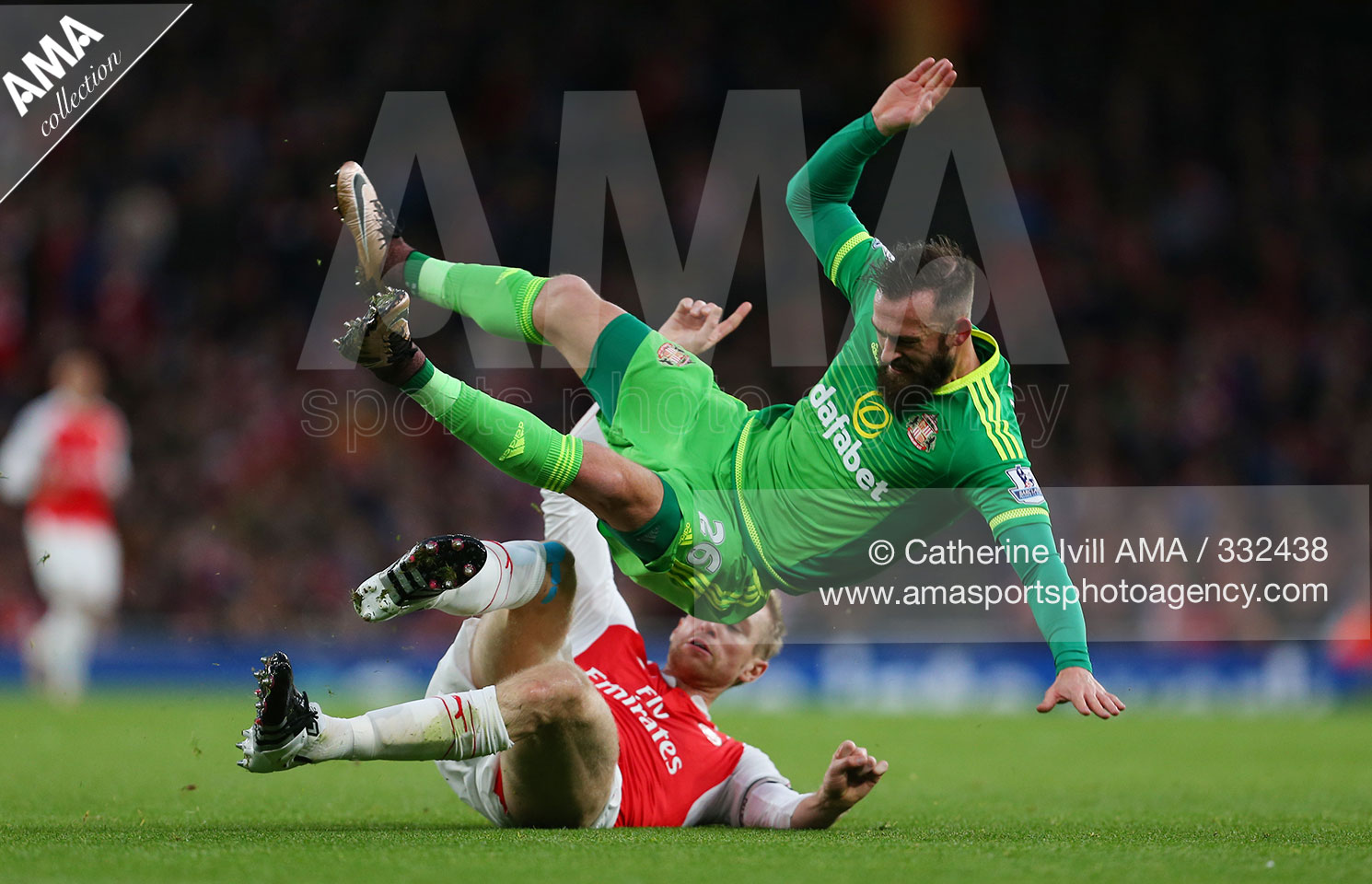 Barclays Premier League - Arsenal v Sunderland - Steven Fletcher of Sunderland flies over Per Mertesacker of Arsenal CATHERINE IVILL AMA