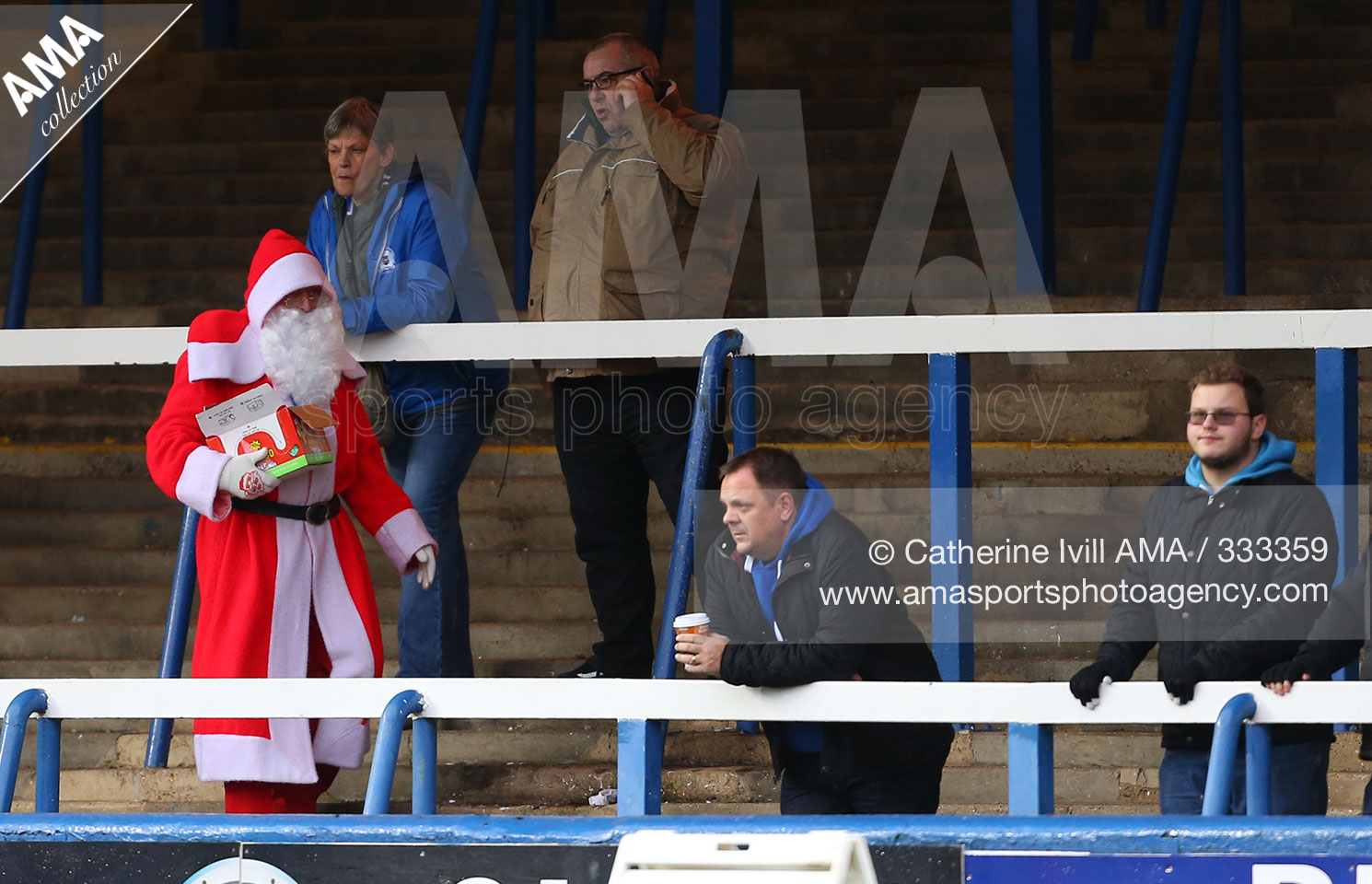 CATHERINE IVILL AMA Sky Bet League One - Peterborough United v Shrewsbury Town - A fan dressed as Father Christmas makes his way across the terraces