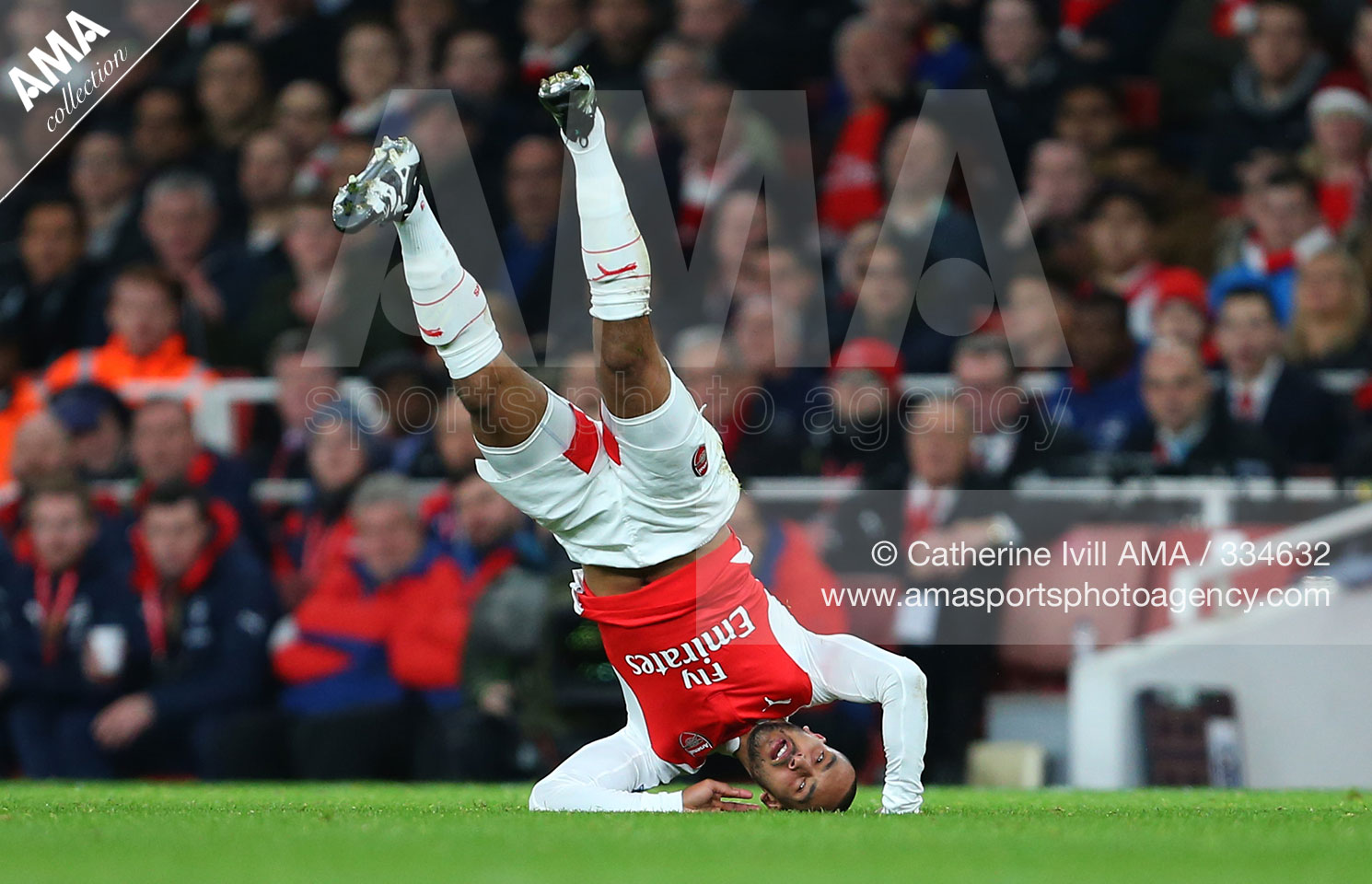 Barclays Premier League - Arsenal v Manchester City Theo Walcott of Arsenal on his head - CATHERINE IVILL AMA