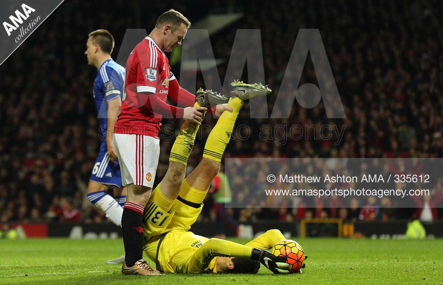 Barclays Premier League - Manchester United v Chelsea - Thibaut Courtois of Chelsea saves from Wayne Rooney of Manchester United  MATTHEW ASHTON AMA