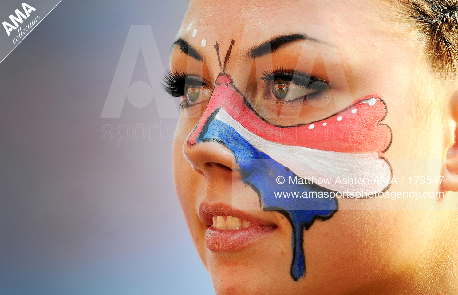 UEFA European Championships  Euro 2012 - Group B - Netherlands v Denmark - A female fan of the Netherlands with a painted butterfly in the colours of her home nation on her face 179547