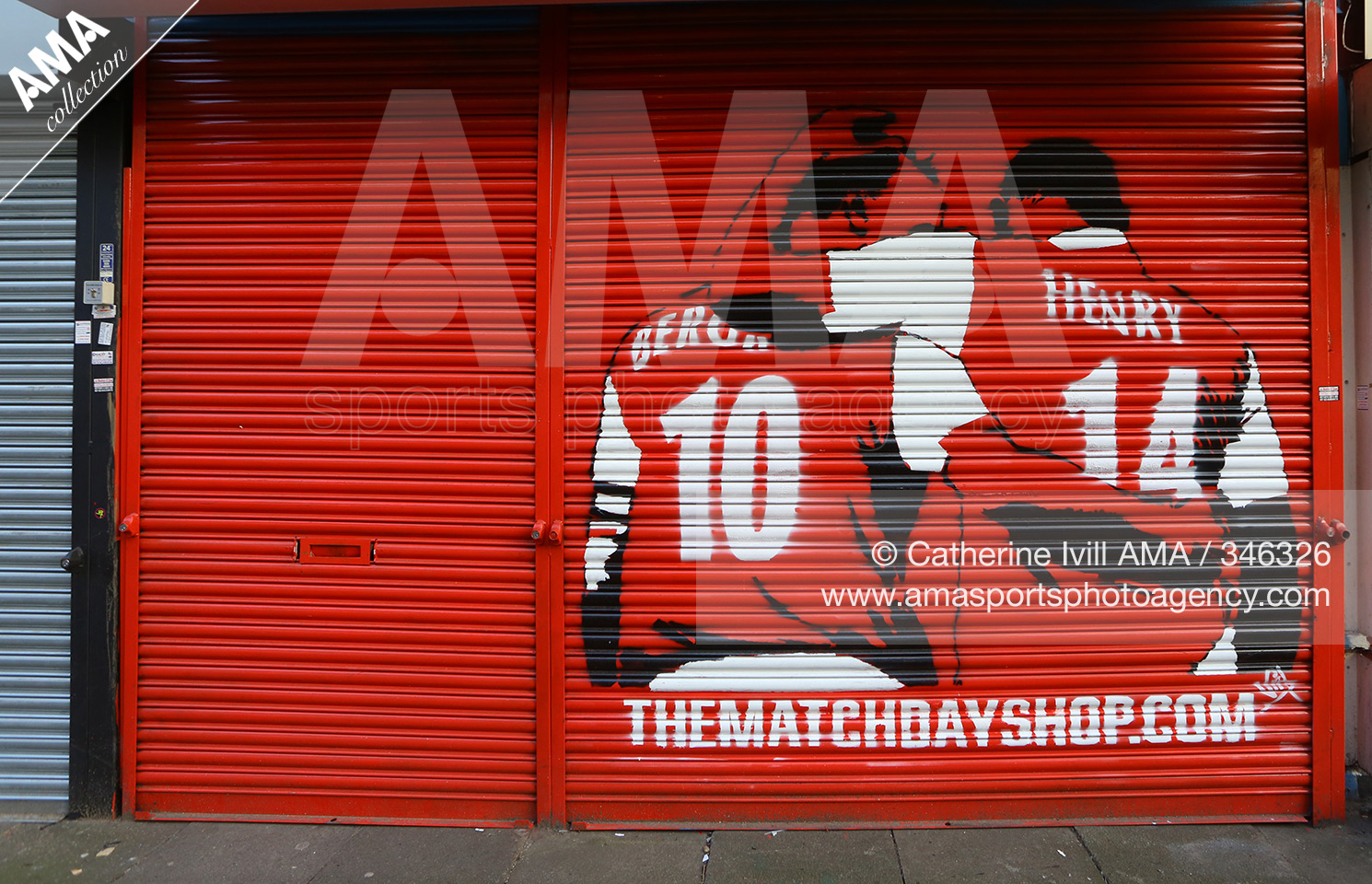 13 March 2016 The Emirates FA Cup Sixth Round - Arsenal v Watford - An image of Dennis Bergkamp and Thierry Henry of Arsenal on the shutter of the Matchday merchandise shop © Catherine Ivill / AMA 346326