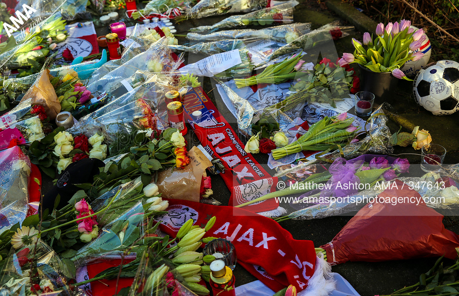 25 March 2016 Fans pay homeage to Johan Cruyff - Flowers and gifts are left outside the house where Dutch football legend Johan Cruyff grew up, after he died aged 69 in Barcelona, Spain on March 24th 2016. The property at Akkerstraat 32, on the corner wit