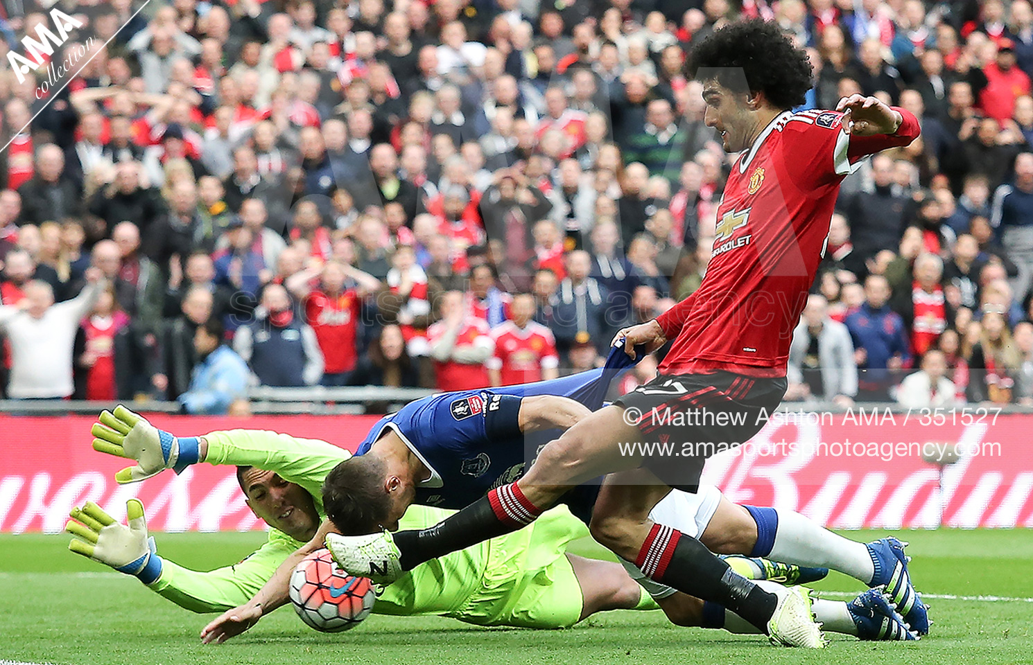 FA Cup Semi Final - Everton v Manchester United - Phil Jagielka of Everton blocks the attempt on goal of Marouane Fellaini of Manchester United with his hand