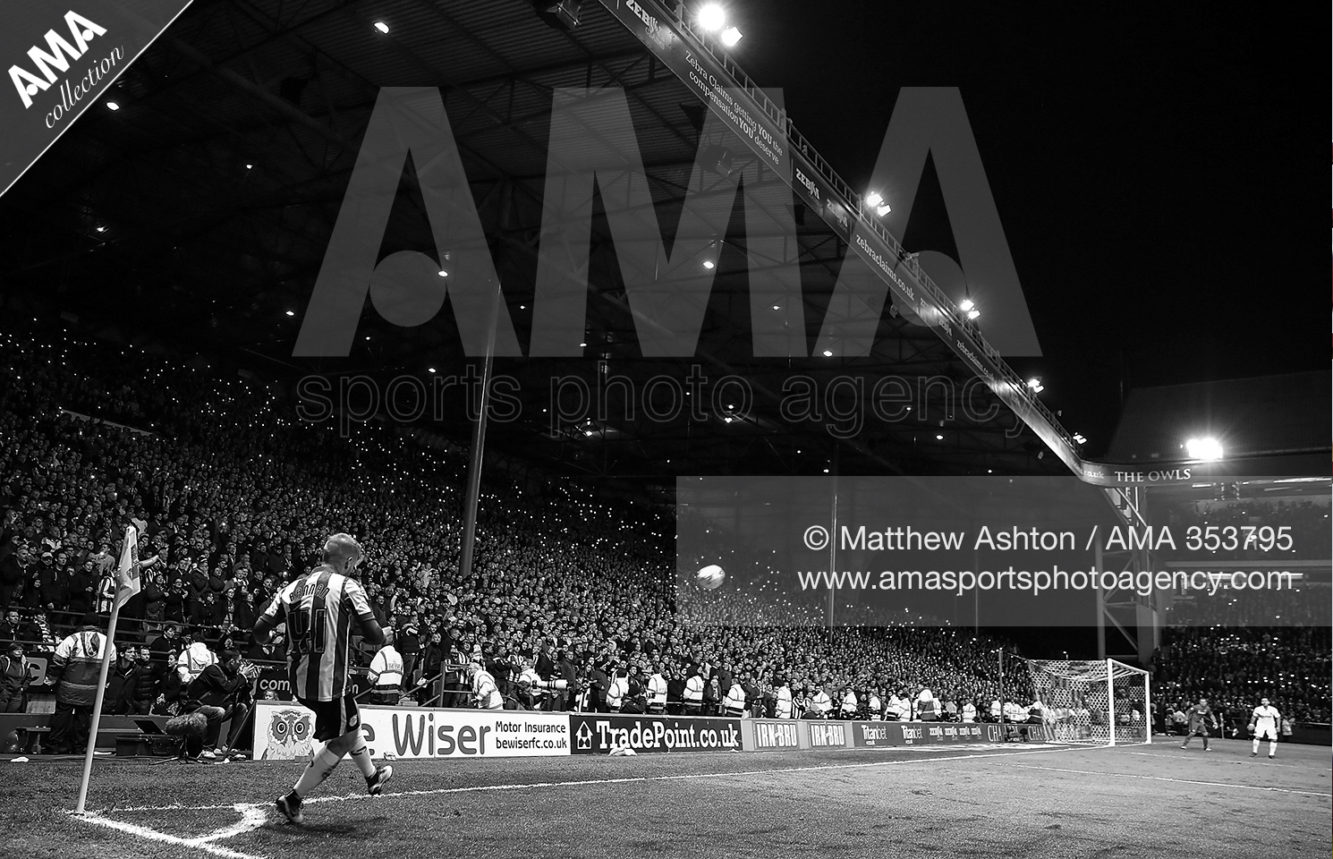 13 May 2016 - Sky Bet Championship Play Off First Leg - Sheffield Wednesday v Brighton & Hove Albion Barry Bannan of Sheffield Wednesday takes a corner at Hillsborough Stadium as fans on The Kop shine their mobile phones © Matthew Ashton AMA 353795