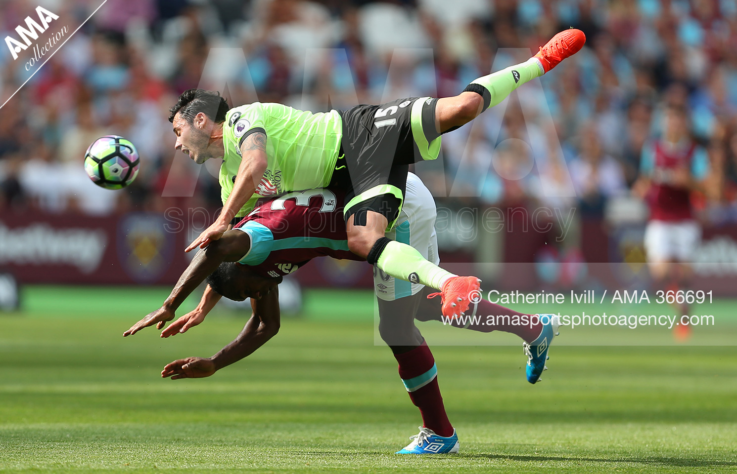 English Premier League - West Ham United v AFC Bournemouth - Adam Smith of Bournemouth goes over the top of Michail Antonio of West Ham 
