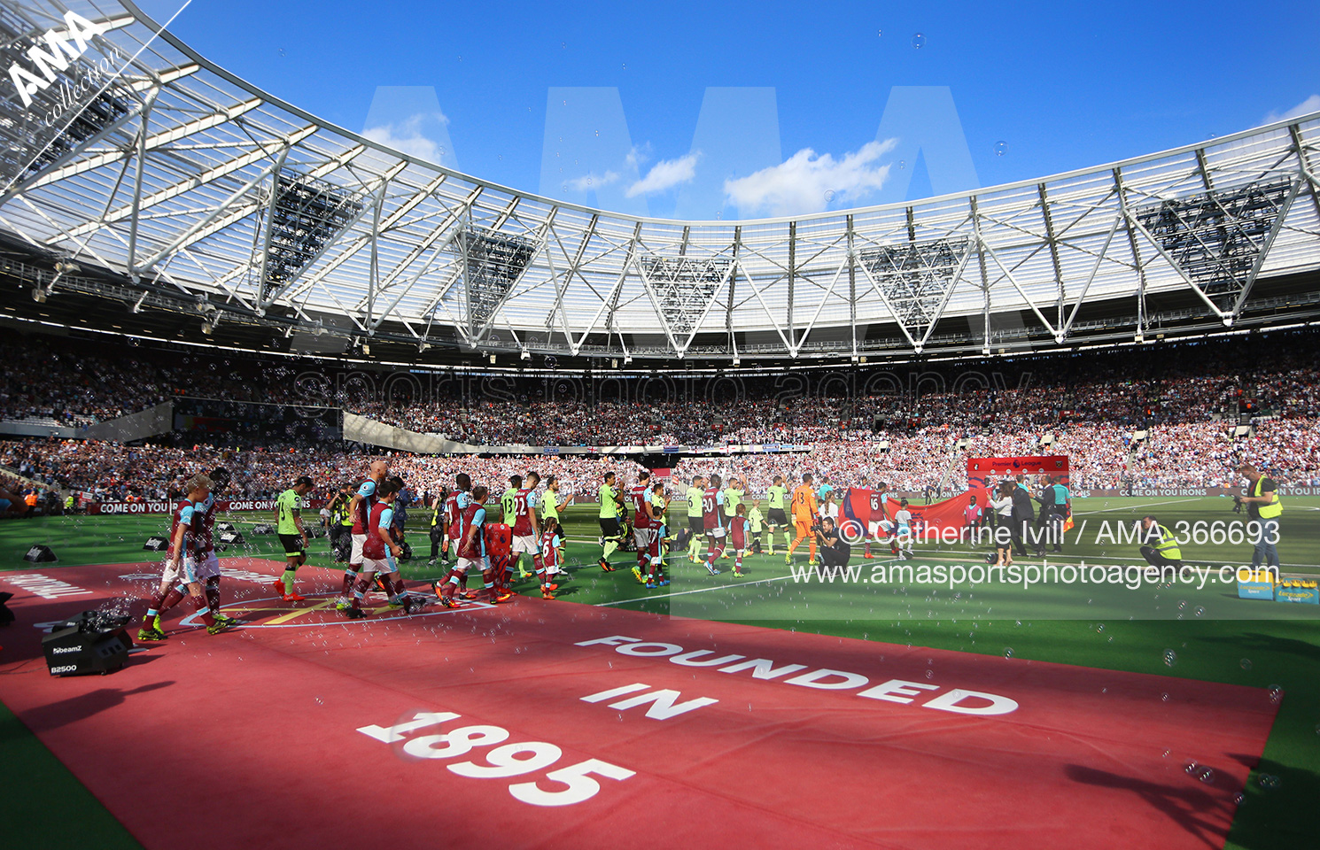 The West Ham United and AFC Bournemouth teams make their way out onto he pitch for the first ever Premier League match at the Olympic stadium, home of West Ham United