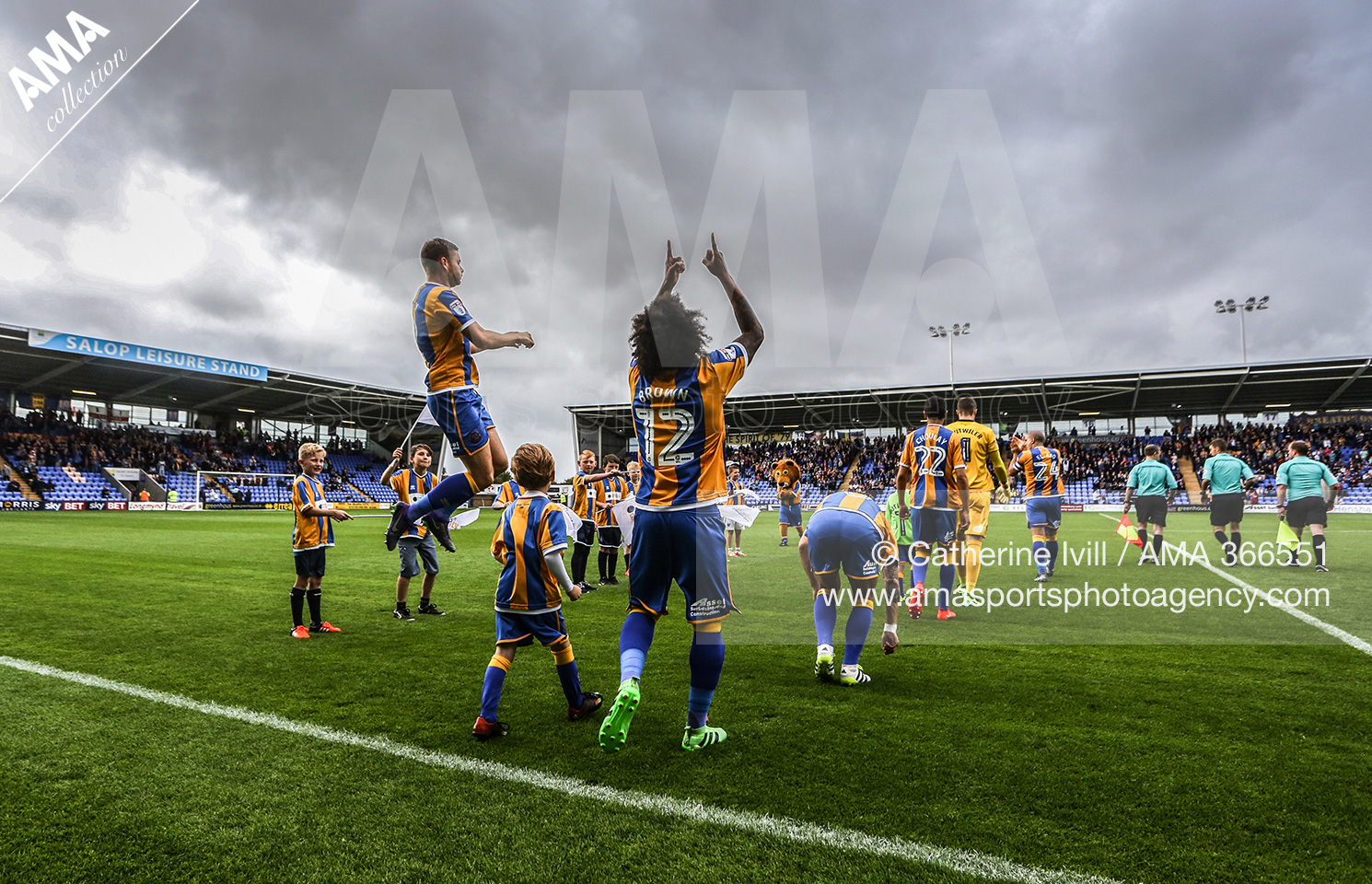 Junior Brown of Shrewsbury Town looks to the skies as the teams come out onto the pitch 